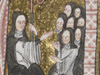Een abdis met haar nonnen in een middeleeuwse initiaal